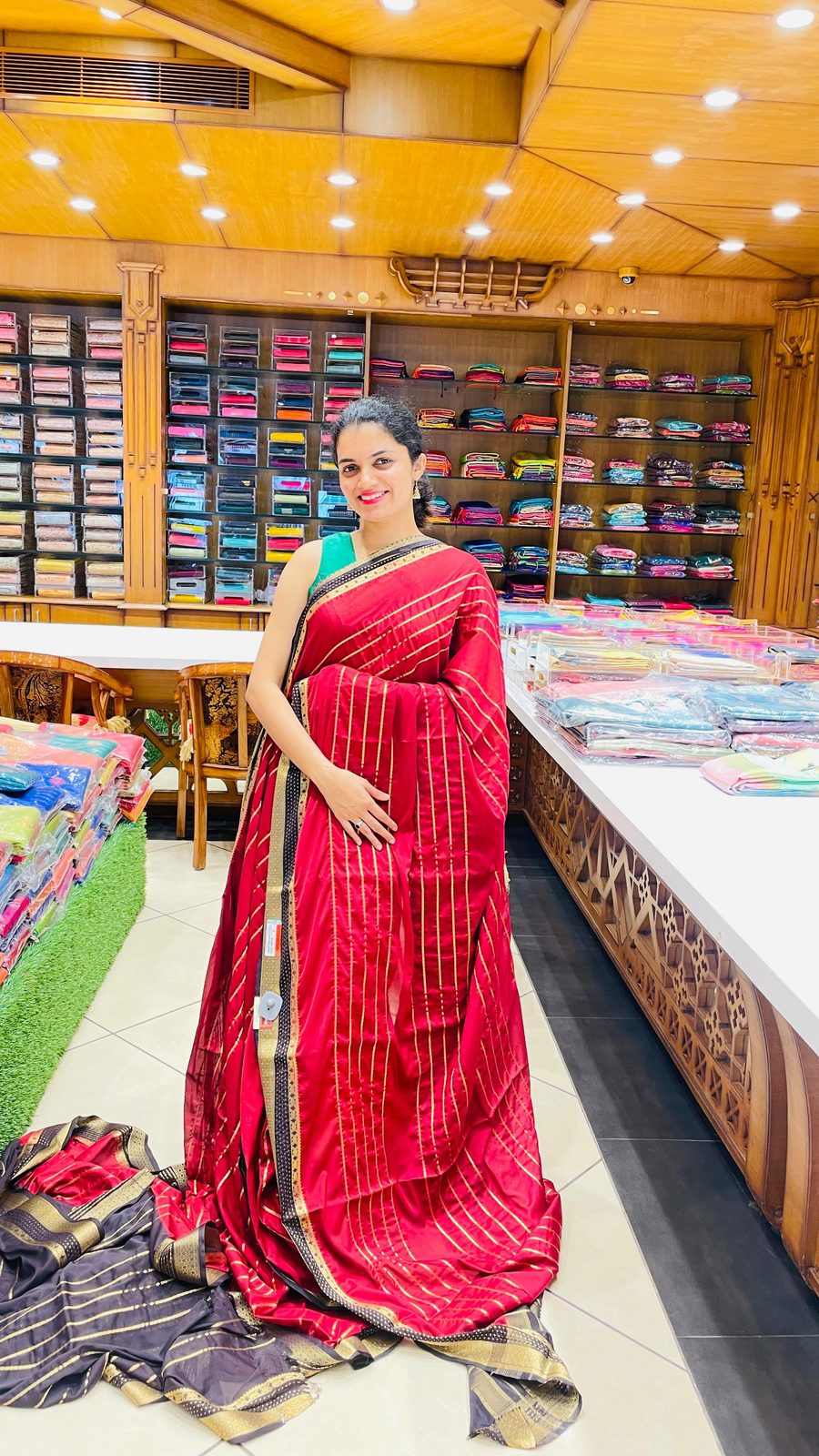 Folded Banarasi saree with multi-colour border weave on a woven mat