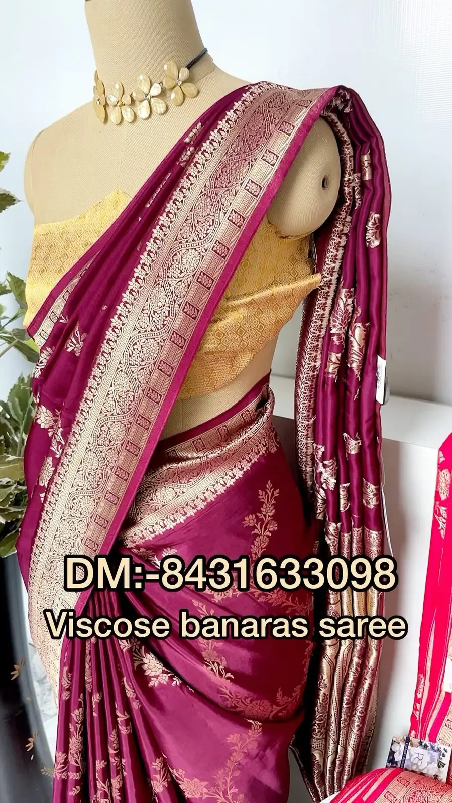 Mannequin in a maroon viscose Banarasi saree with zari jangla work